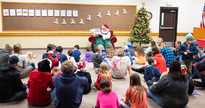 Mrs. Claus reading to children